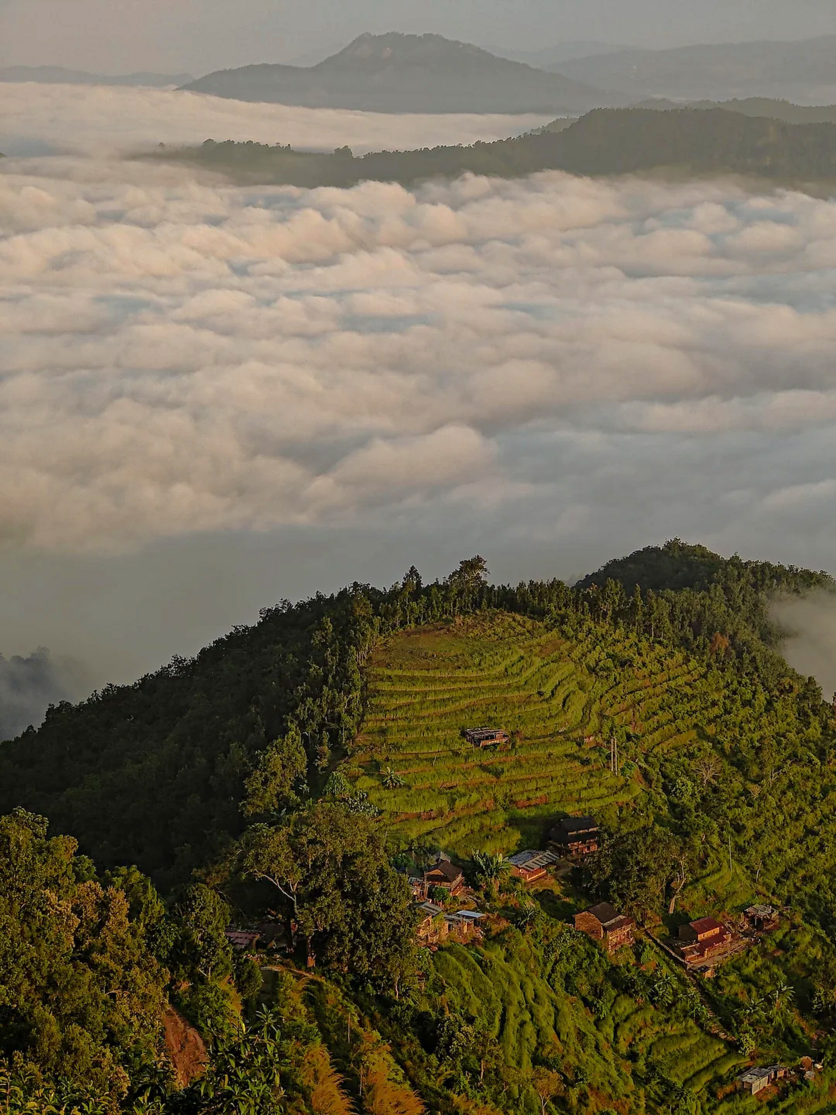 Ancient Newari hill town of Bandipur perched high above a rolling sea of morning clouds